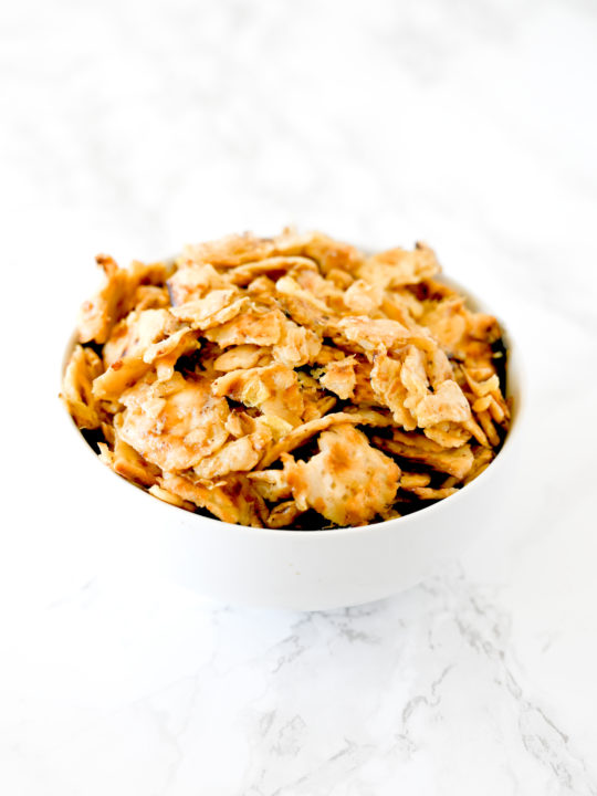 Matzo Brei in a white bowl on a white marble counter