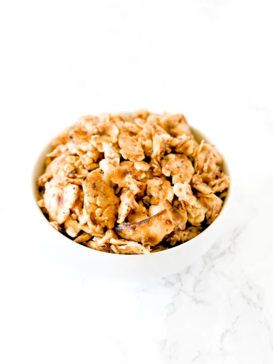 Sweet Matzo Brei in a white bowl on a white marble counter