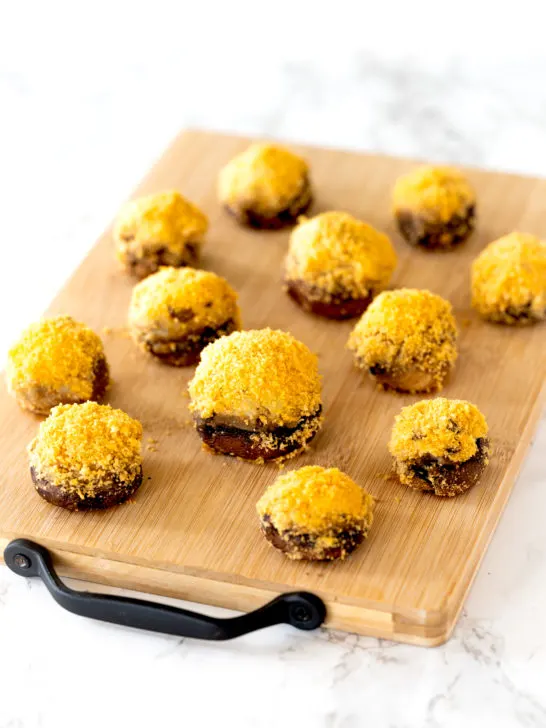 Dairy free stuffed mushrooms on a cutting board