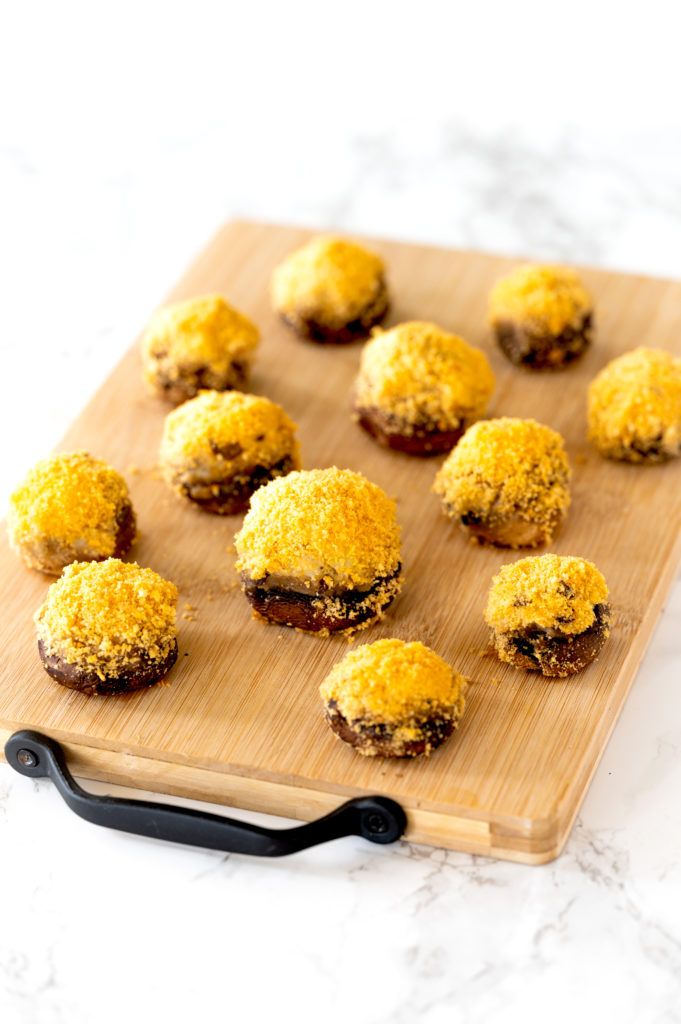 Dairy free stuffed mushrooms on a cutting board