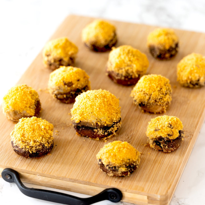 Dairy free stuffed mushrooms on a cutting board