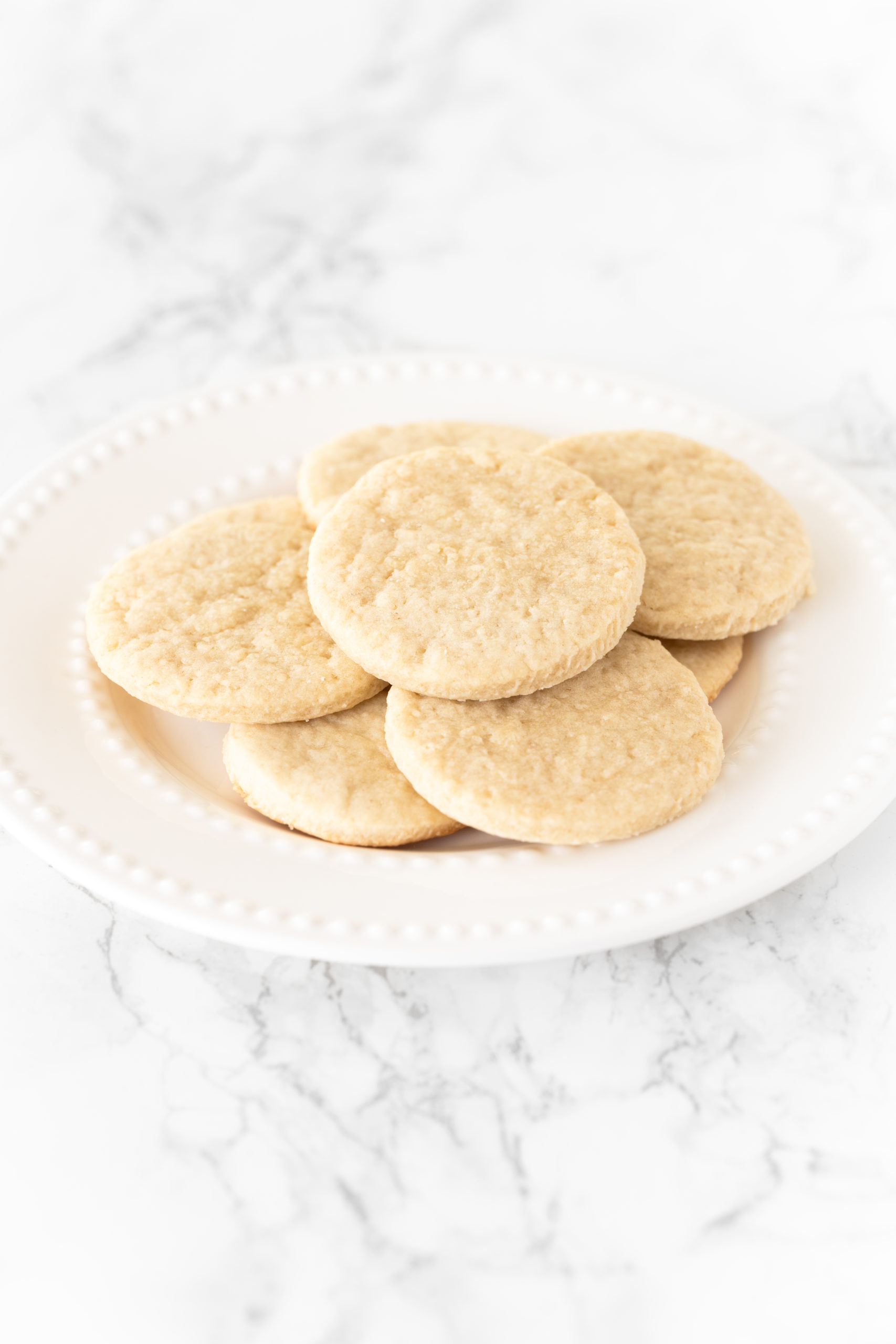 Sugar cookies made without butter on a white plate