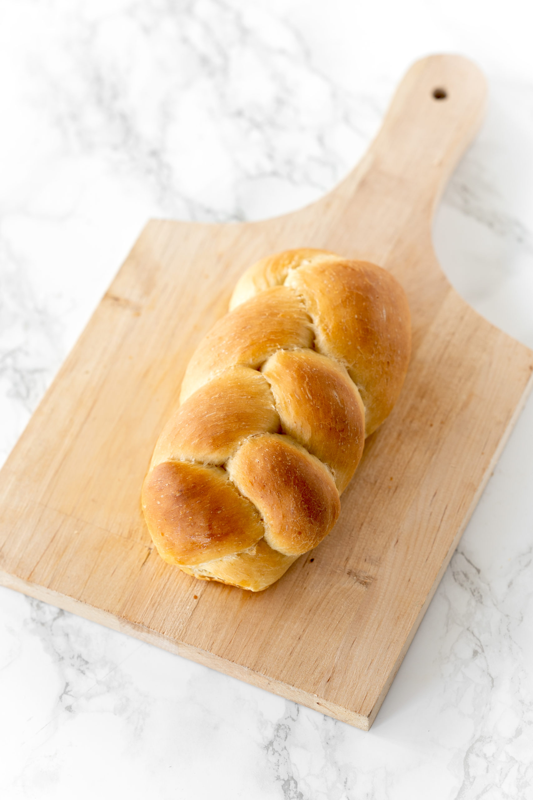 vegan challah bread on a cutting board