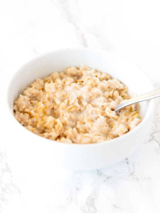 oatmeal in a white bowl on a white marble counter